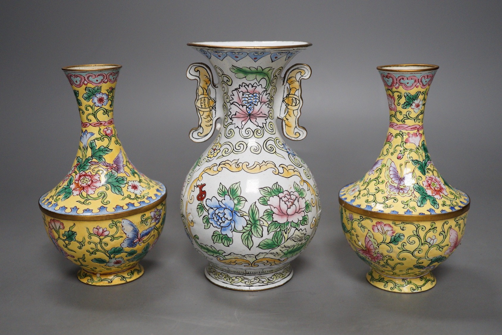 A pair of Chinese Guangzhou yellow enamel vases and another similar vase, tallest 15cms high.